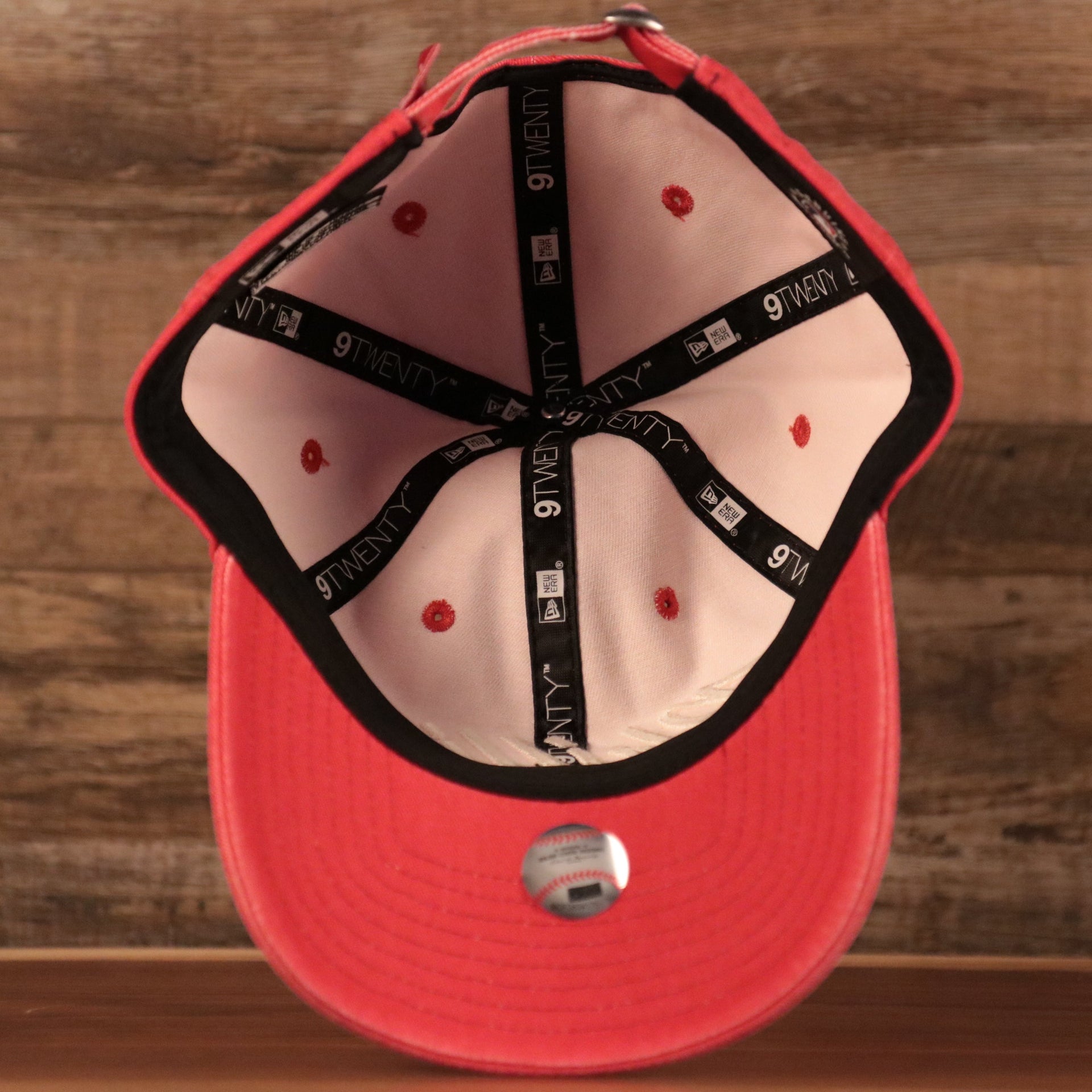 An inside view of the washed pink womens 9twenty ball cap for the Phillies by New Era.