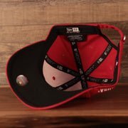 An inside view of the black underbrim Philadelphia Phillies 2021 fourth of July red 9twenty dad hat by New Era.