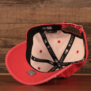 The inside look of the washed pink Philadelphia Phillies New Era ball cap.