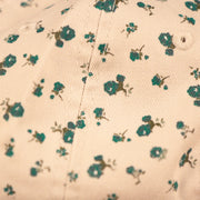 A closeup of the floral pattern on the cream floral baseball cap for the Philadelphia Eagles.