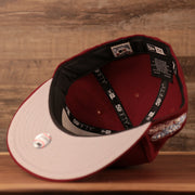 The grey bottom brim of the maroon Philadelphia Phillies 1980 World Series all over patch fitted 59fifty cap by New Era.