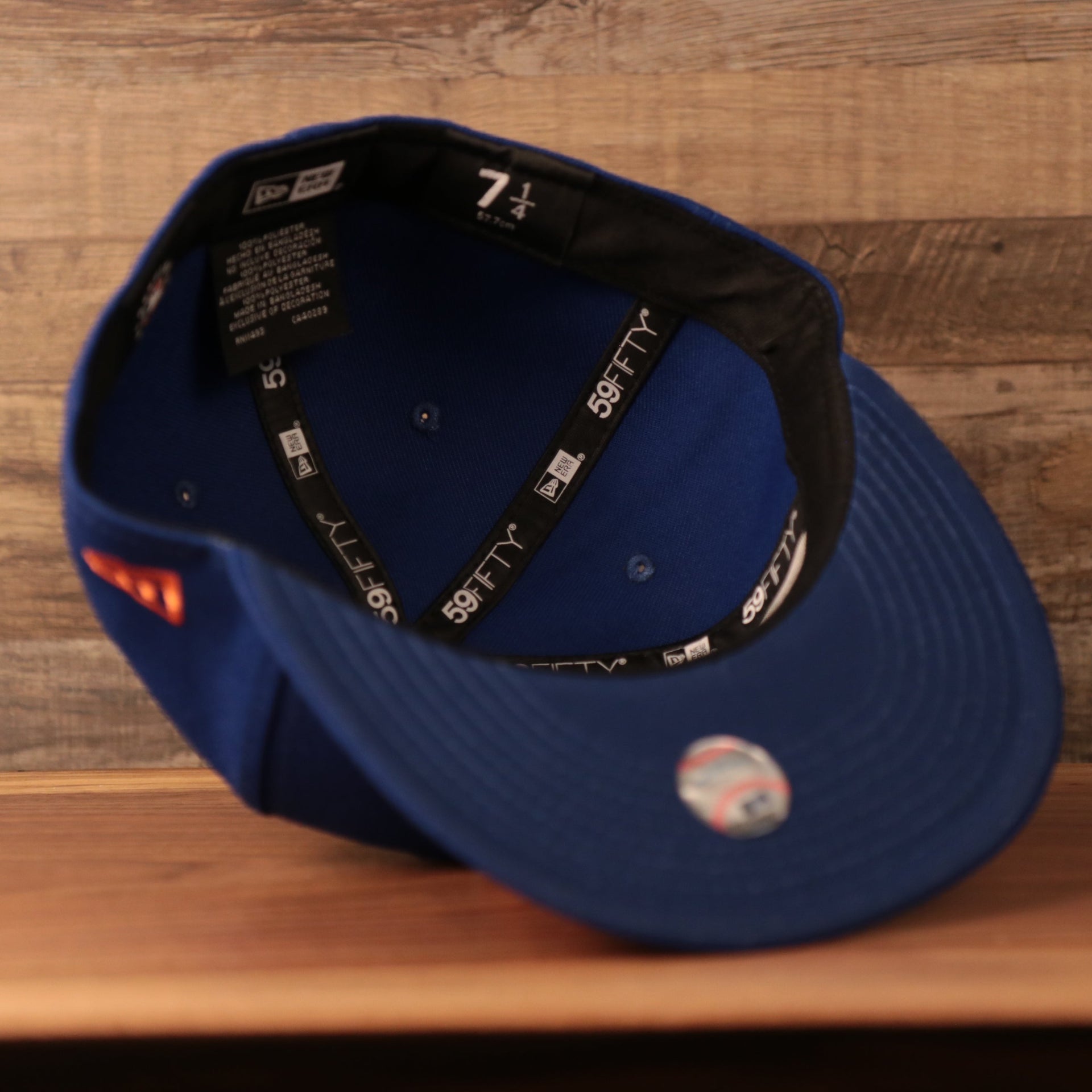 The inside of the crown of the vintage blue side patch New Era fitted cap.