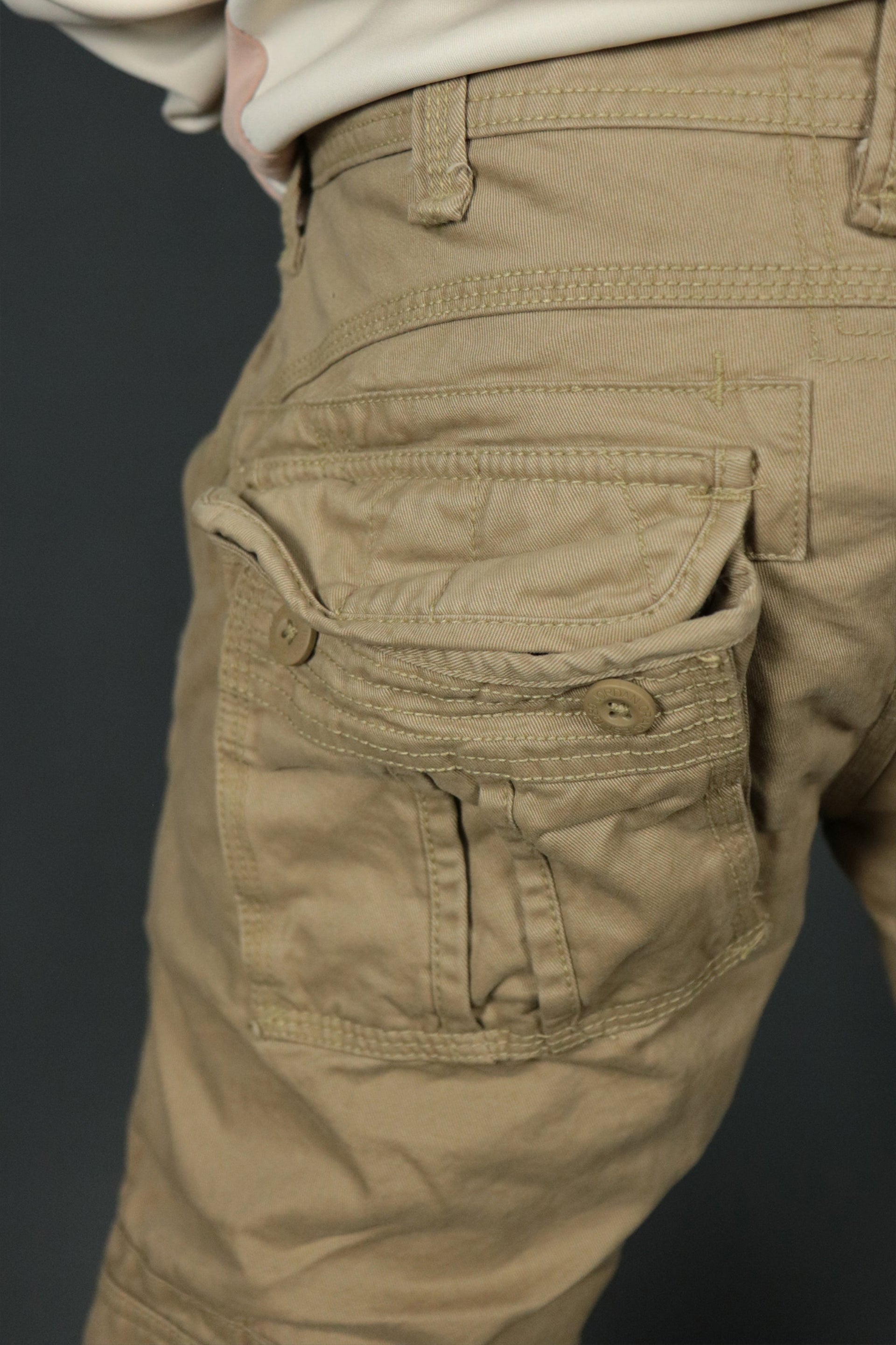 The back pocket of the khaki Jordan Craig cargo pants.