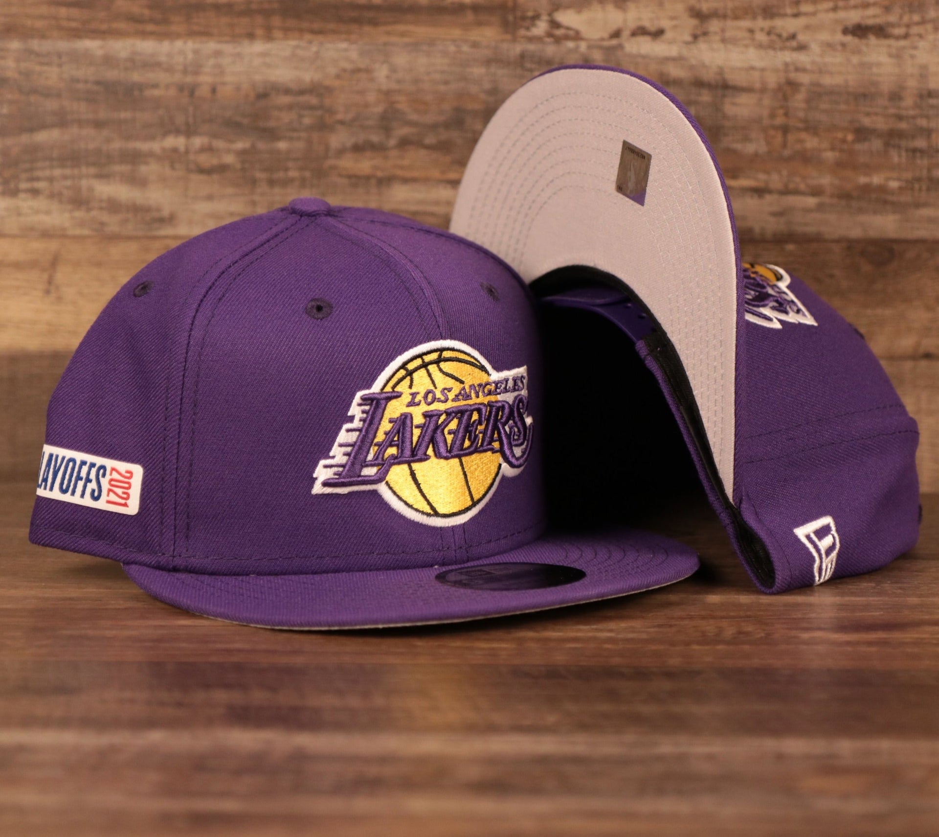 front and bottom of the Los Angeles Lakers 2021 NBA Playoff Side Patch Purple 9Fifty Gray Bottom Snapback Hat