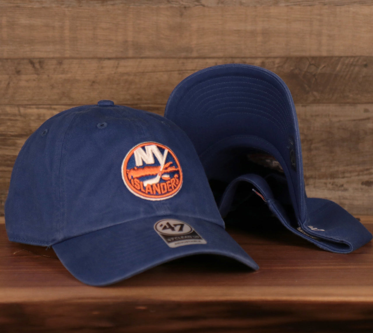 front and bottom of the New York Islanders Royal Blue Adjustable Dad Hat