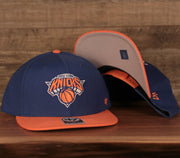 front and bottom of the New York Knicks Royal Blue and Orange Adjustable Grey Bottom Snapback Hat