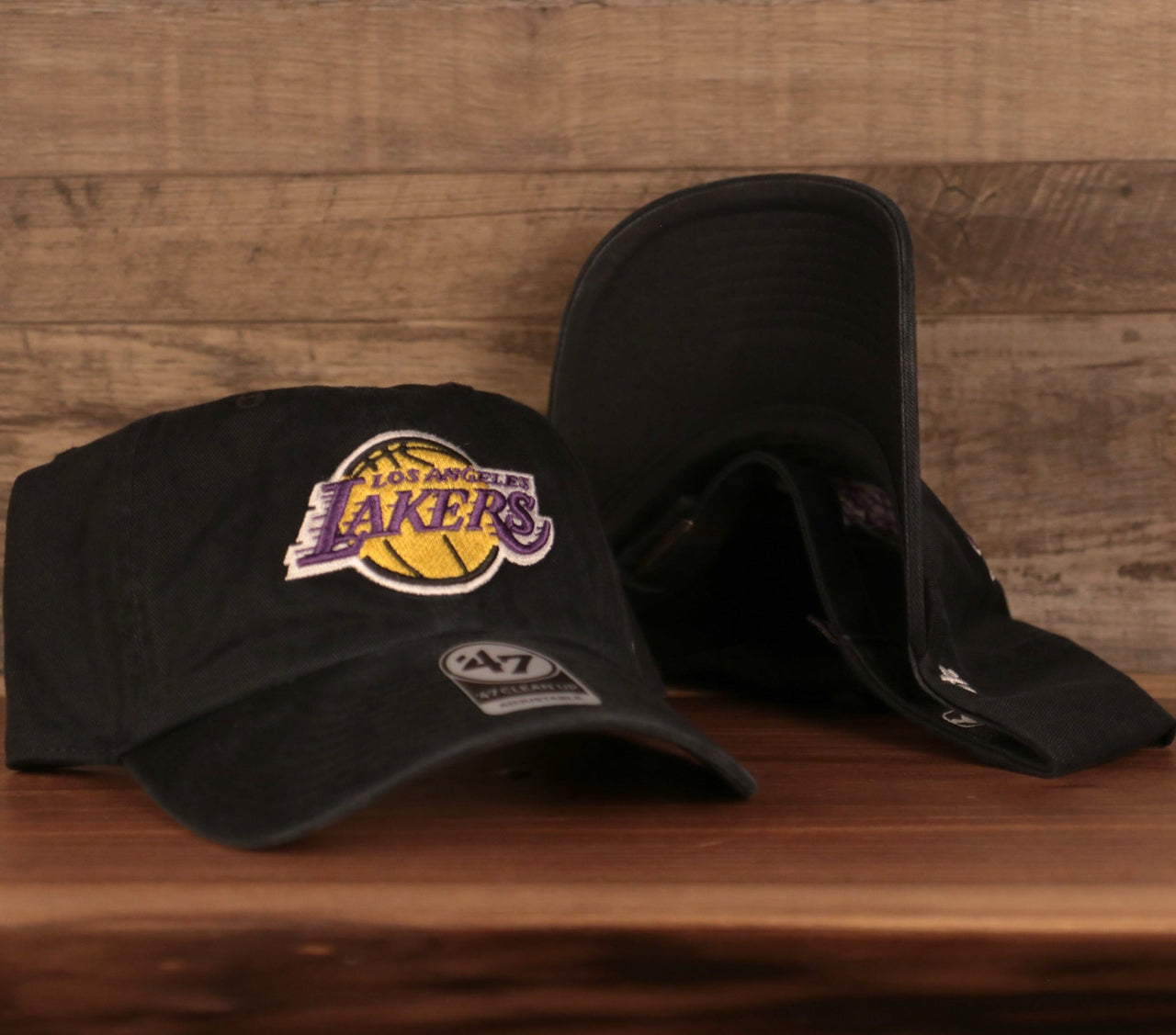 front of the Los Angeles Lakers Black Adjustable Dad Hat