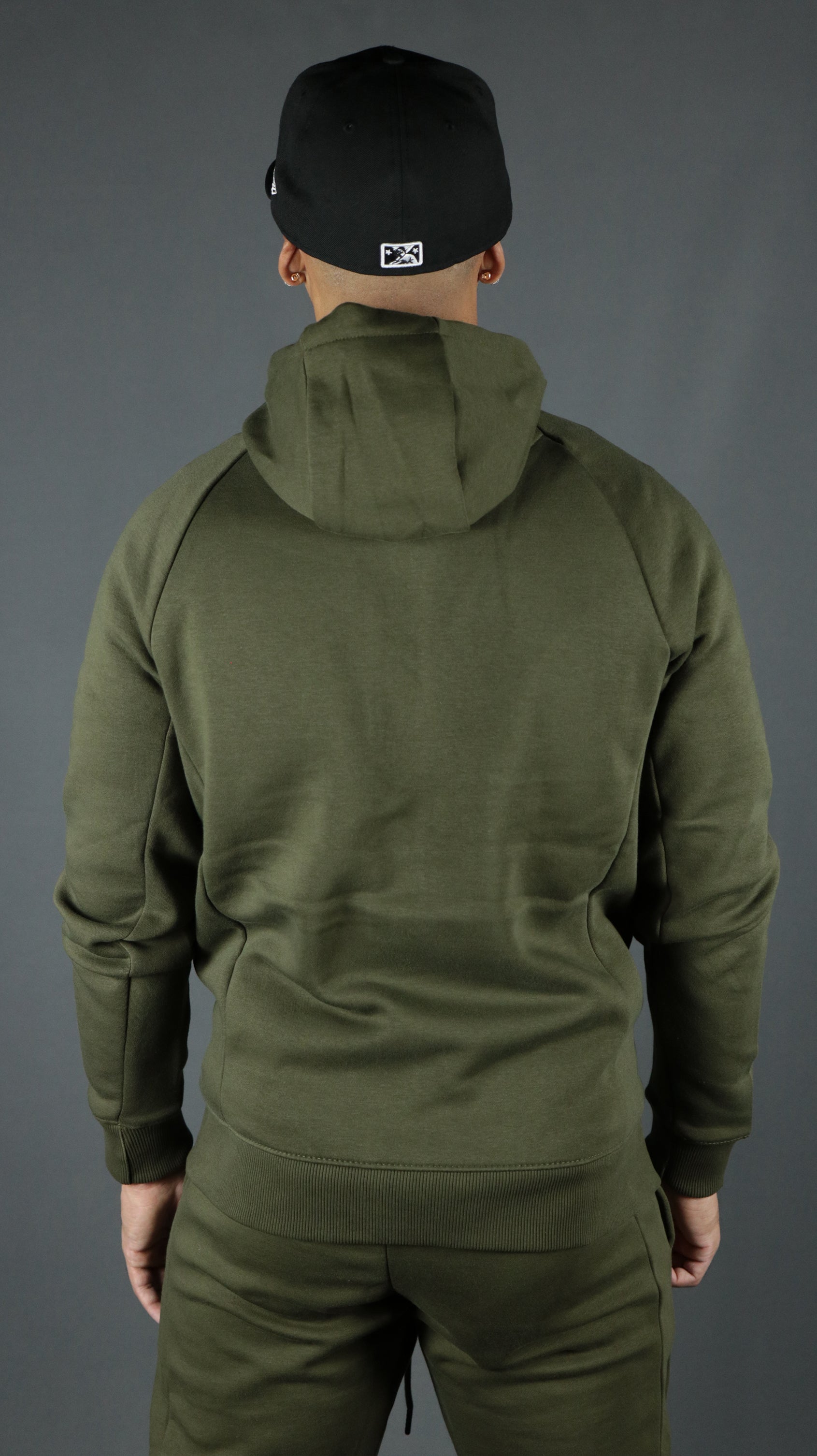 The olive military green Jordan Craig tech fleece hoodie from the back side.