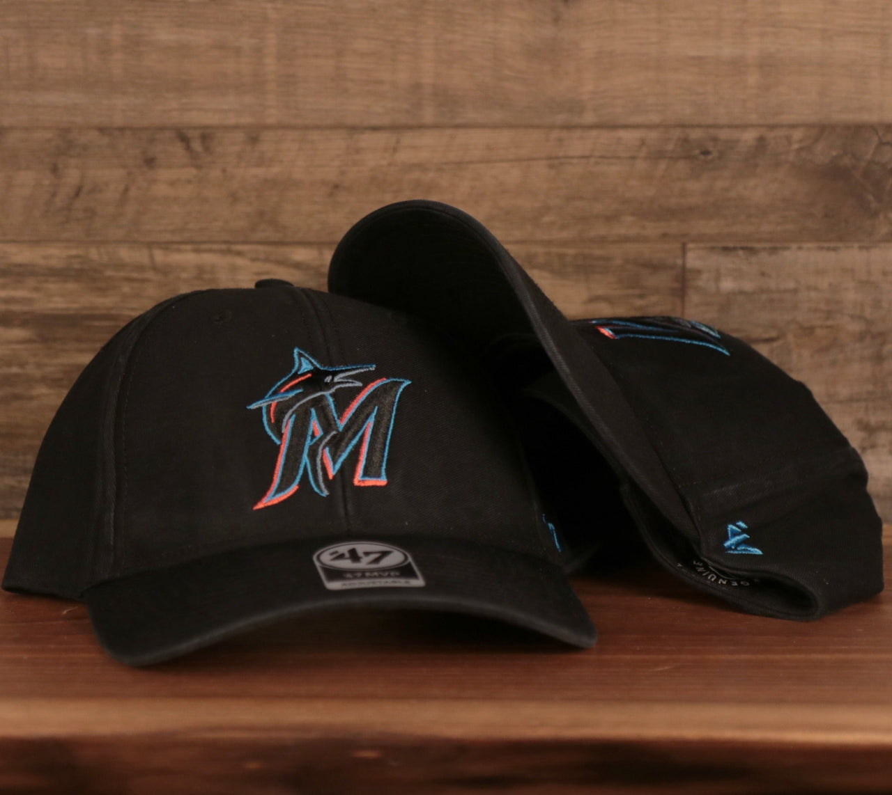 front and bottom of the Miami Marlins Black Adjustable Dad Hat