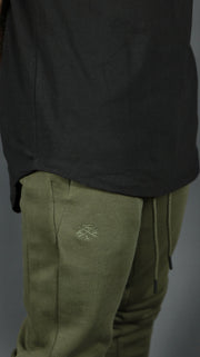 The hem drop cut design of our black elongated t shirt by Jordan Craig.