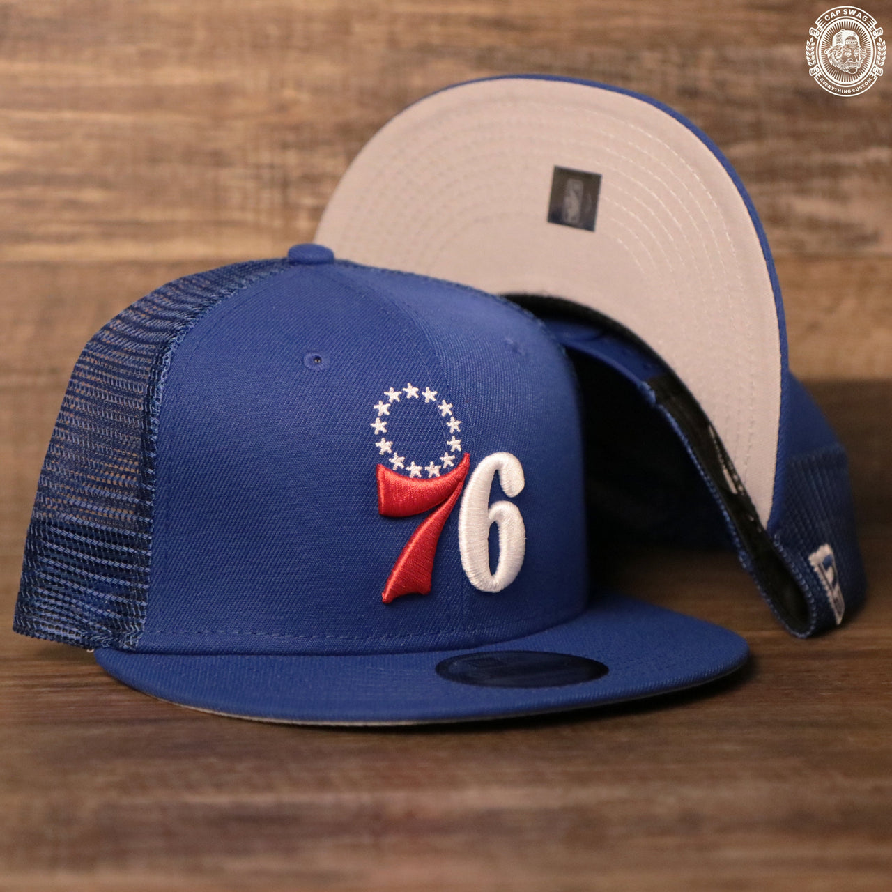 The royal blue Philadelphia 76ers mesh 9fifty snapback hat by New Era.