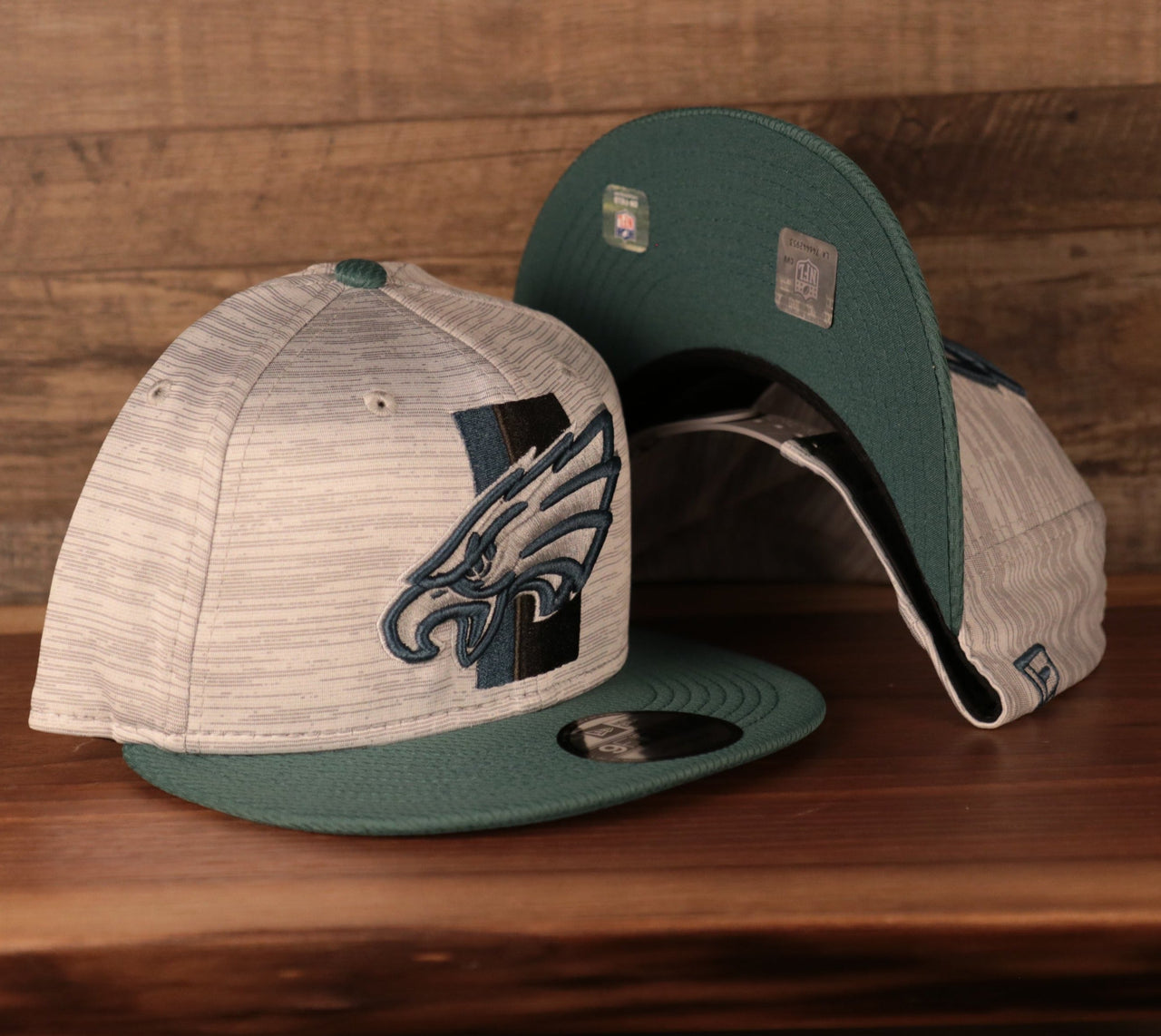 The gray Philadelphia Eagles training hat snapback hat by New Era.