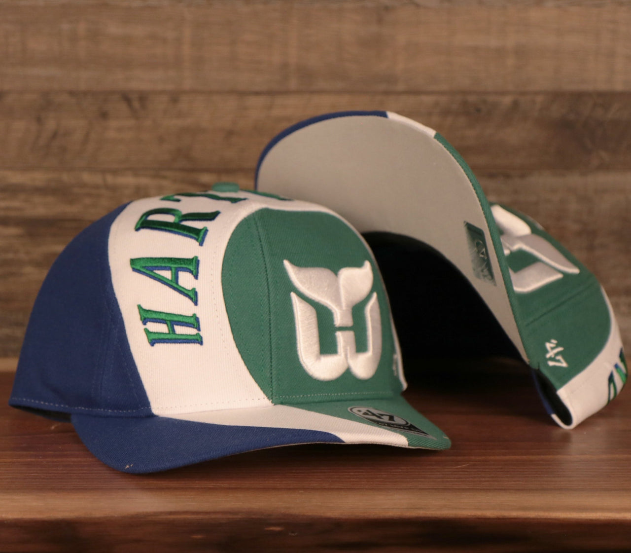 front and bottom of the Hartford Whalers Blue White & Green Retro Adjustable Snapback Cap