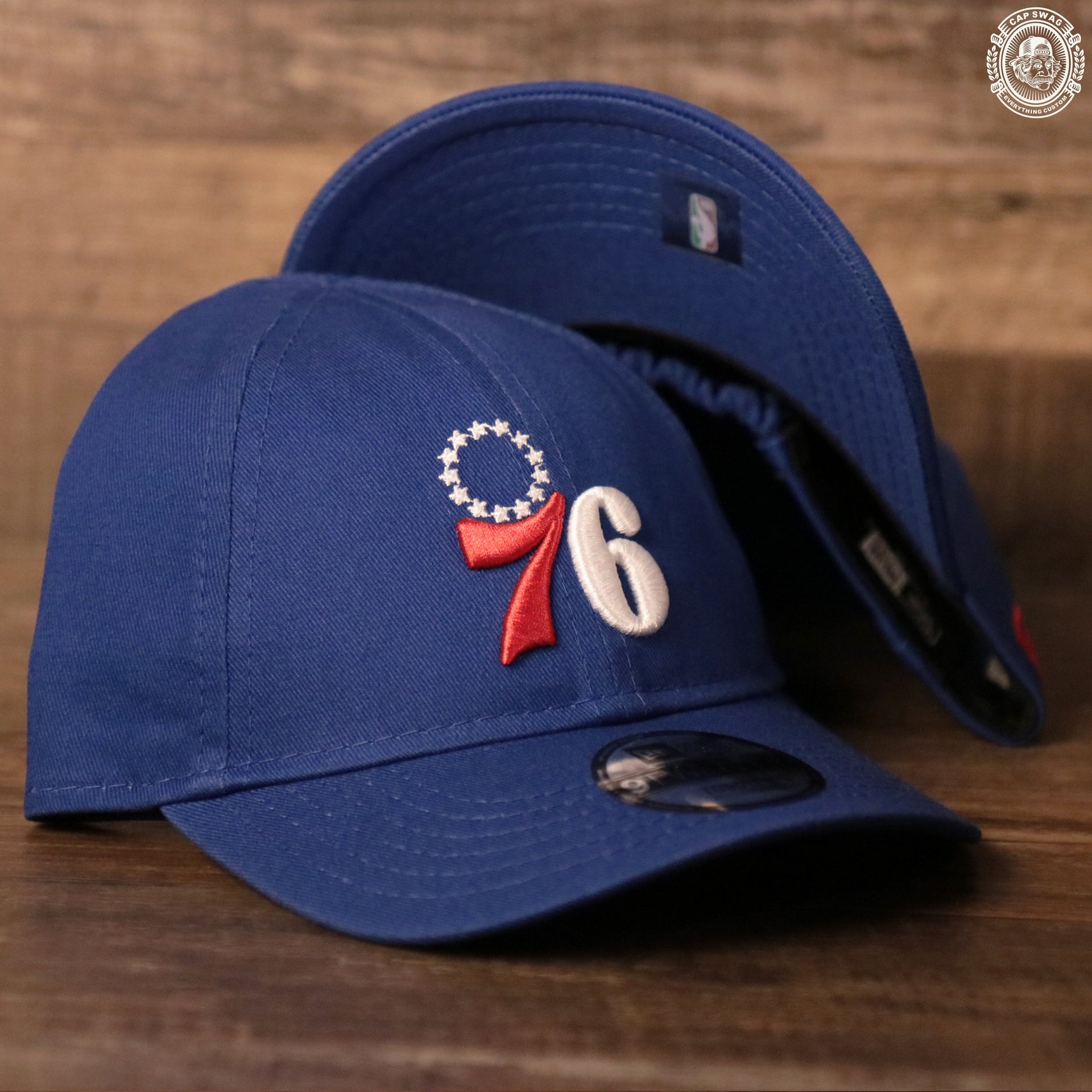 The royal blue Philadelphia 76ers toddler dad hat by New Era.