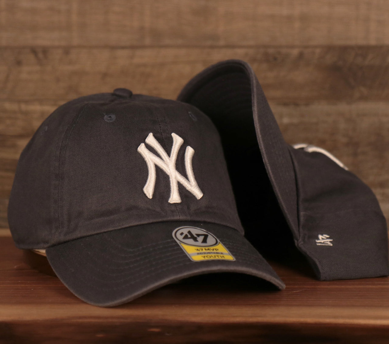 front and bottom of the New York Yankees Navy Blue Adjustable Youth Dad Hat