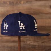 The right side of the navy New Era 59fifty has the two logos of the team.