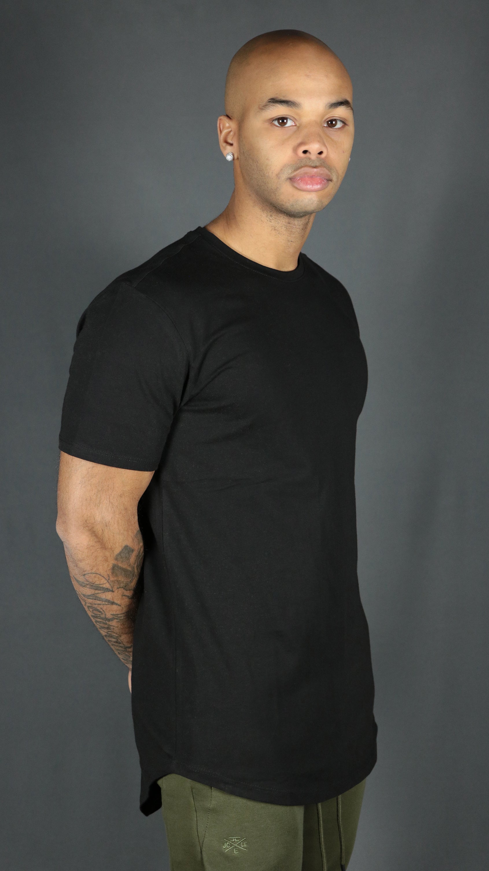 The cool design of our black longline scoop bottom tshirts by Jordan Craig.