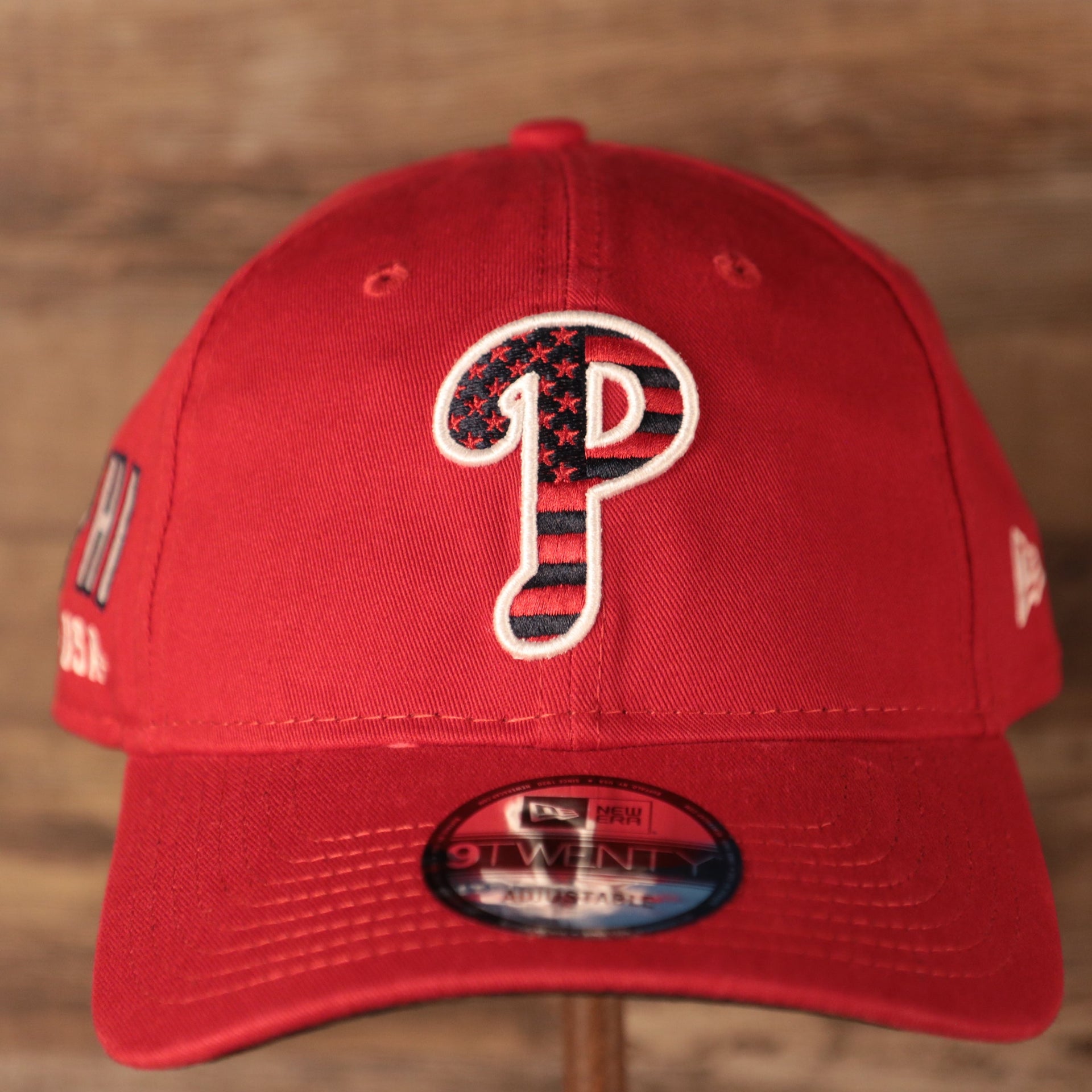 The front side of the red Philadelphia Phillies MLB fourth of July 2021 9twenty dad hat by New Era.