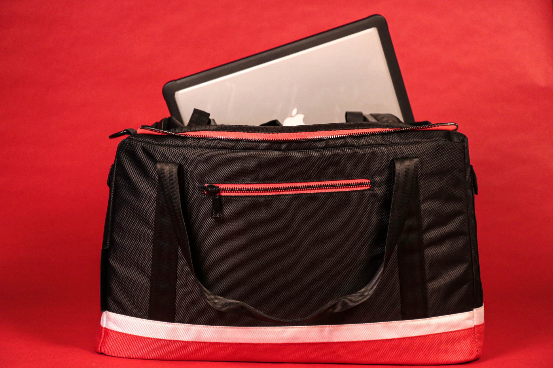 The front of the Flight Pack Sneaker Duffle Bag To Match Bred 11s | Sneaker Duffel Travel Bag with a tablet inside 