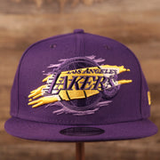 The Los Angeles Lakers logo tear patch on the front side of the purple 9fifty snapback hat.