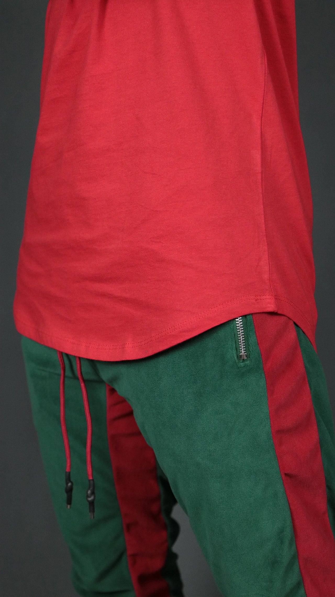 The scoop bottom of the red men's longline t-shirt by Jordan Craig.