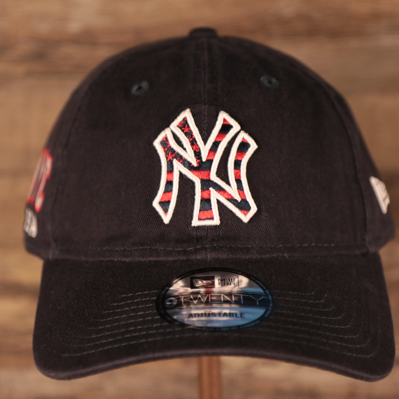The front side of the navy New York Yankees MLB fourth of July 2021 9twenty dad hat by New Era.
