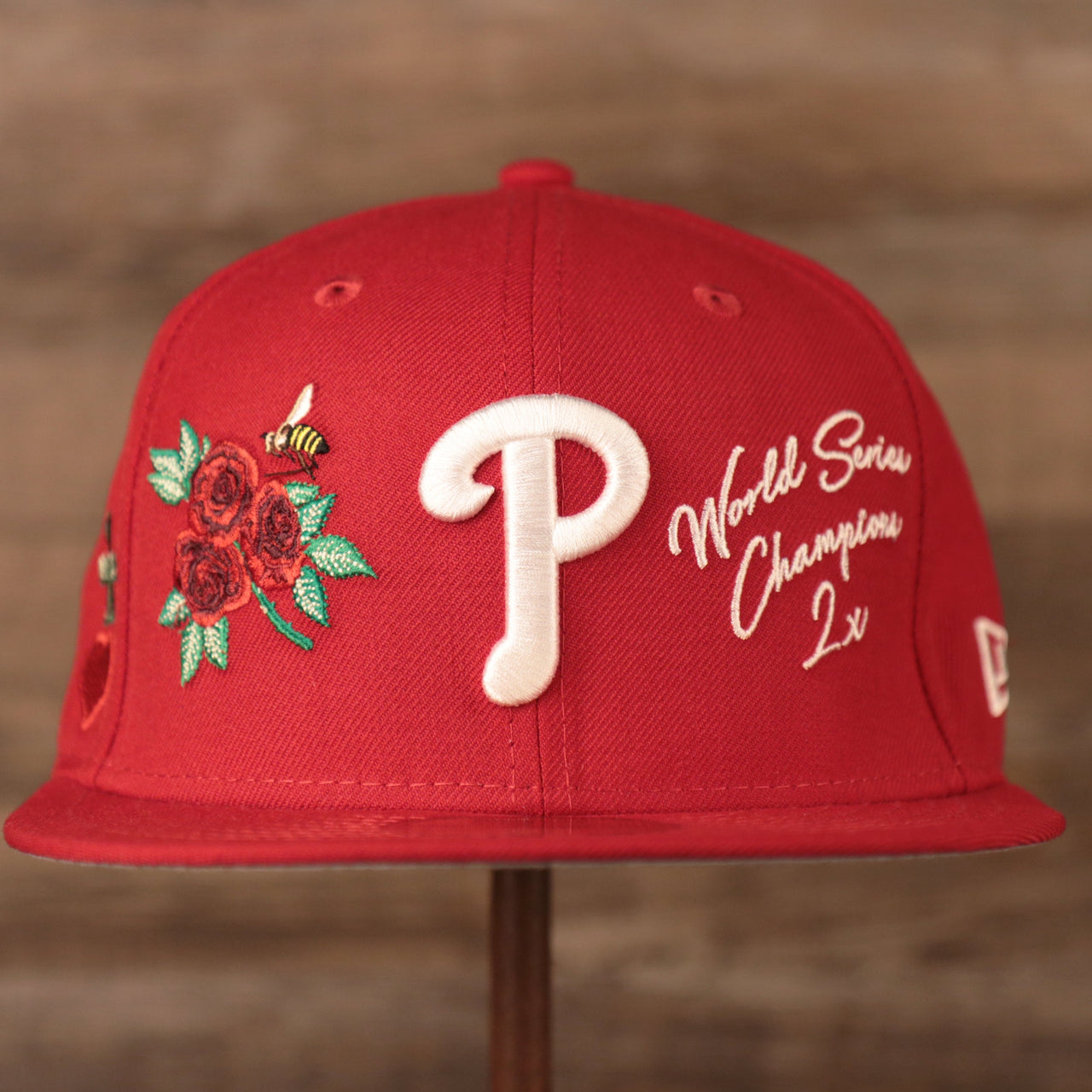The front of the Phillies red all over patch fitted hat with white World Series Champions 2x logo.