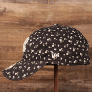 The wearer's left side of the New York Yankees women micro floral cap.