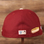 The NBA logo and the cheesesteak patch on the backside of the maroon Philadelphia Phillies 1980 World Series patch Phillies fitted cap with grey underbrim.