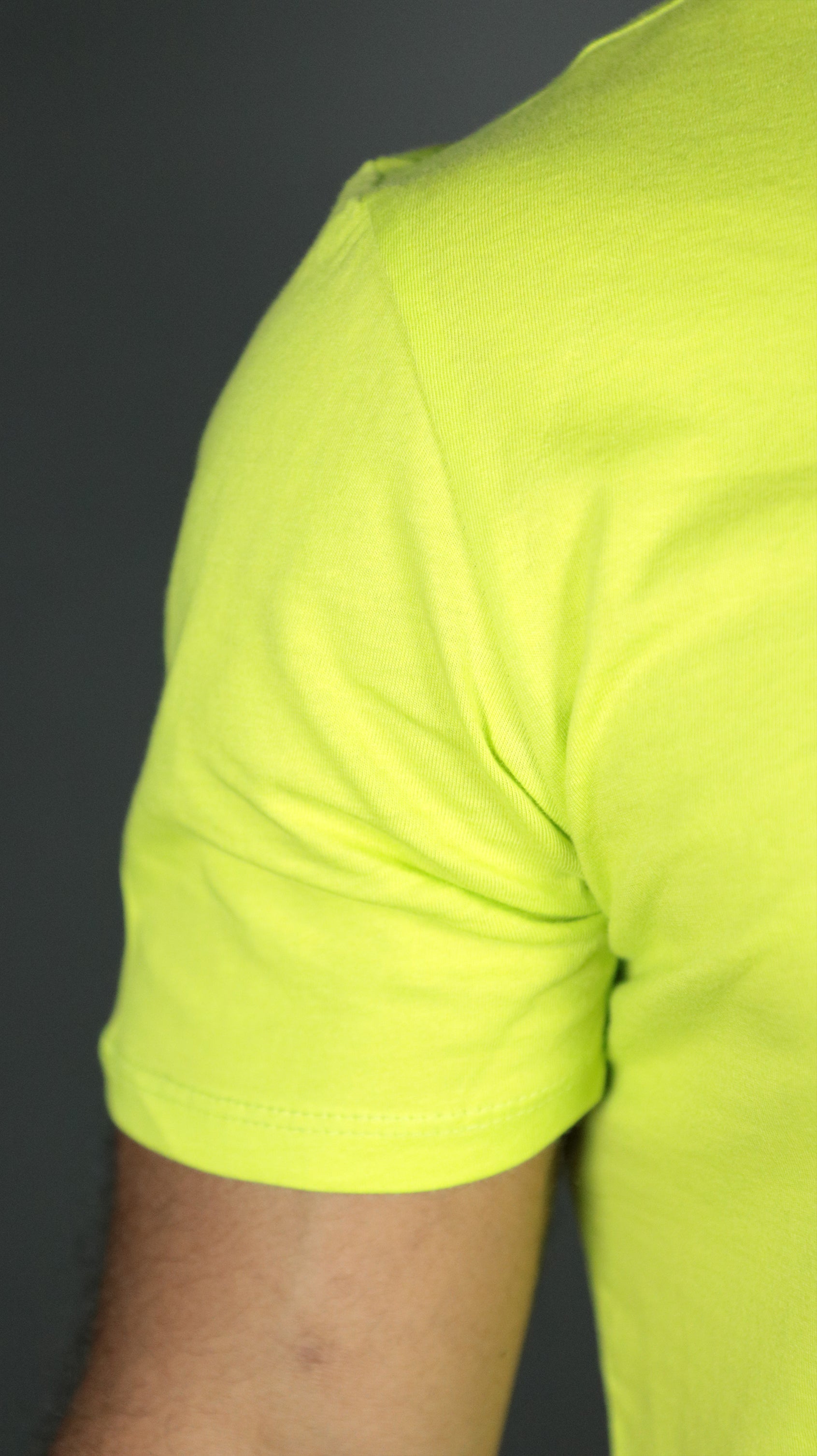 The right shoulder of the yellow Jordan Craig longline scoop bottom tshirt mens.