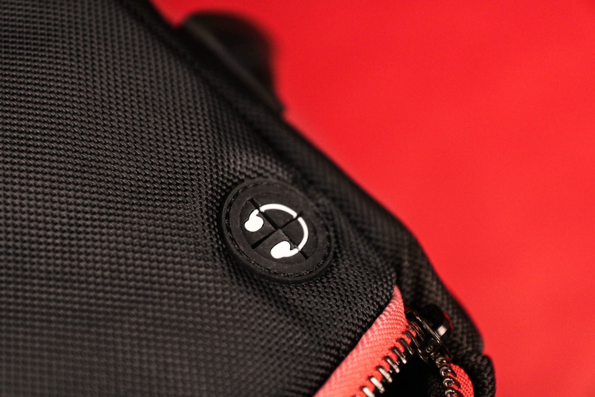 The headphone jack port on the Flight Pack Sneaker Duffle Bag To Match Bred 11s | Sneaker Duffel Travel Bag