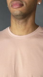 The front side of the pink longline scoop bottom tee for men by Jordan Craig.