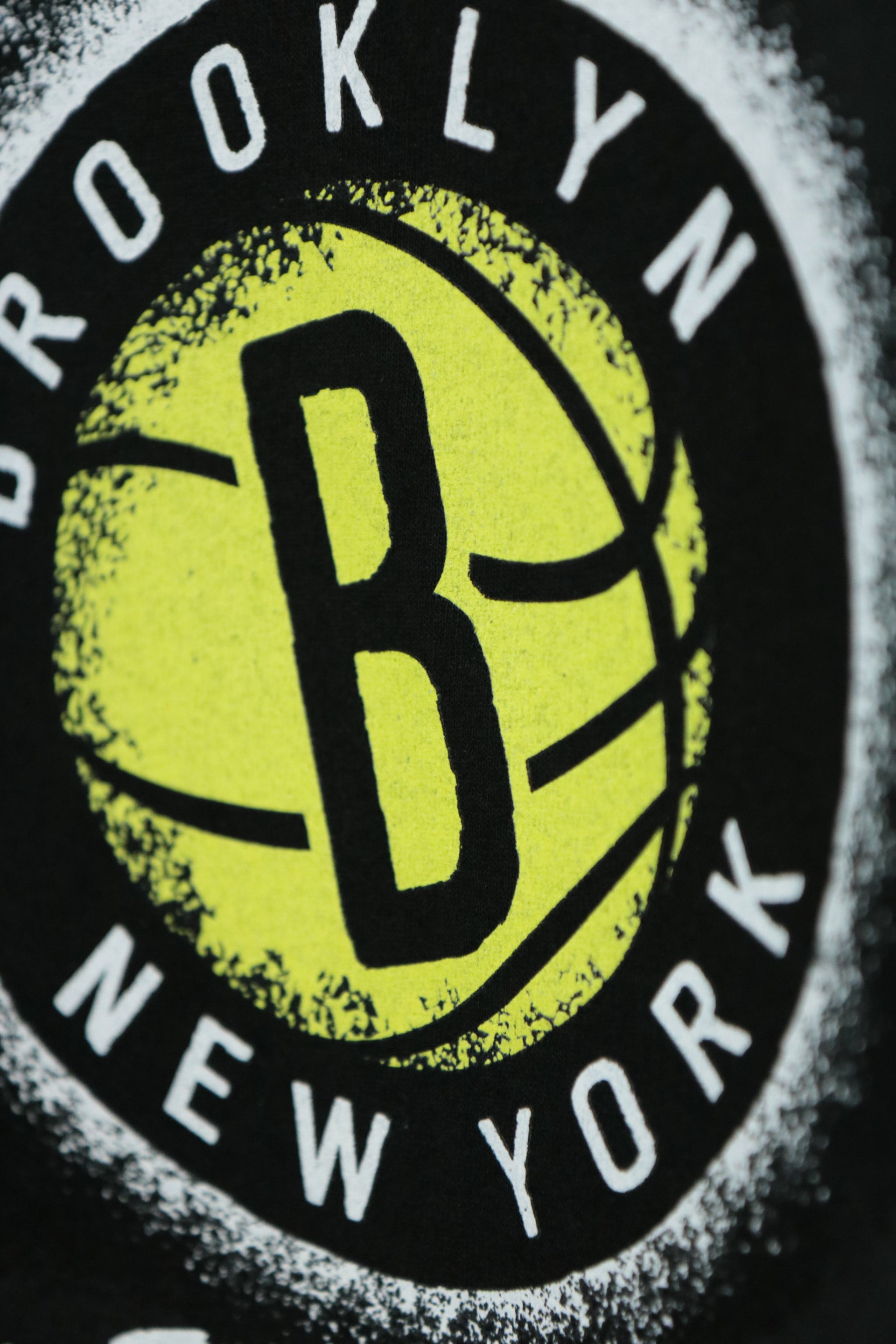 nets logo on the front of the Brooklyn Nets Vintage 90s Washed Print Black T-Shirt