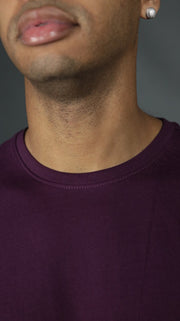 The front of the plum Jordan Craig longline bottom scoop tshirt for men.