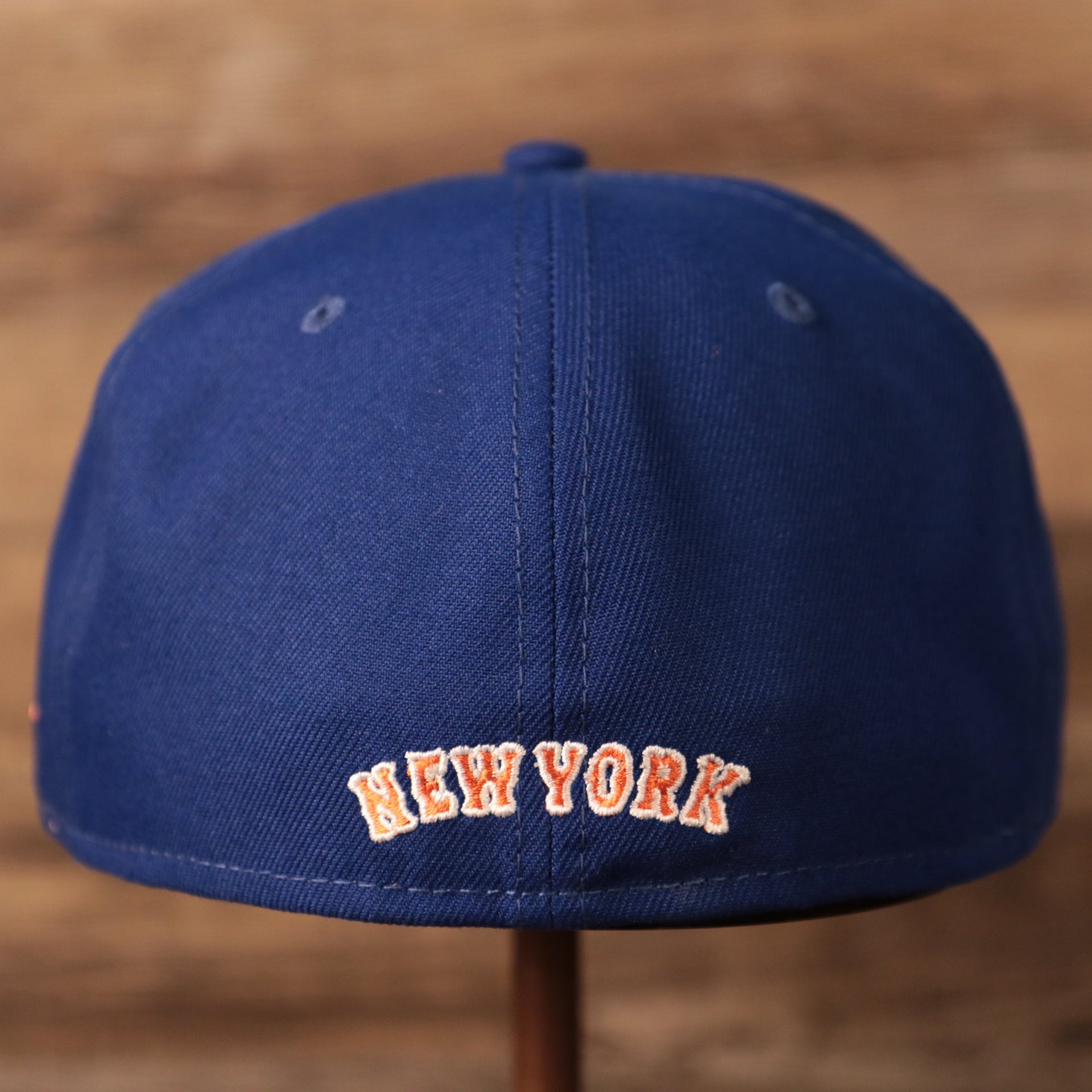 The backside of the New Era blue Mets retro 59fifty.