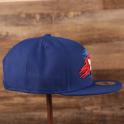 The right side of the youth royal blue logo tear  Philadelphia 76ers 950 snapback hat by New Era.