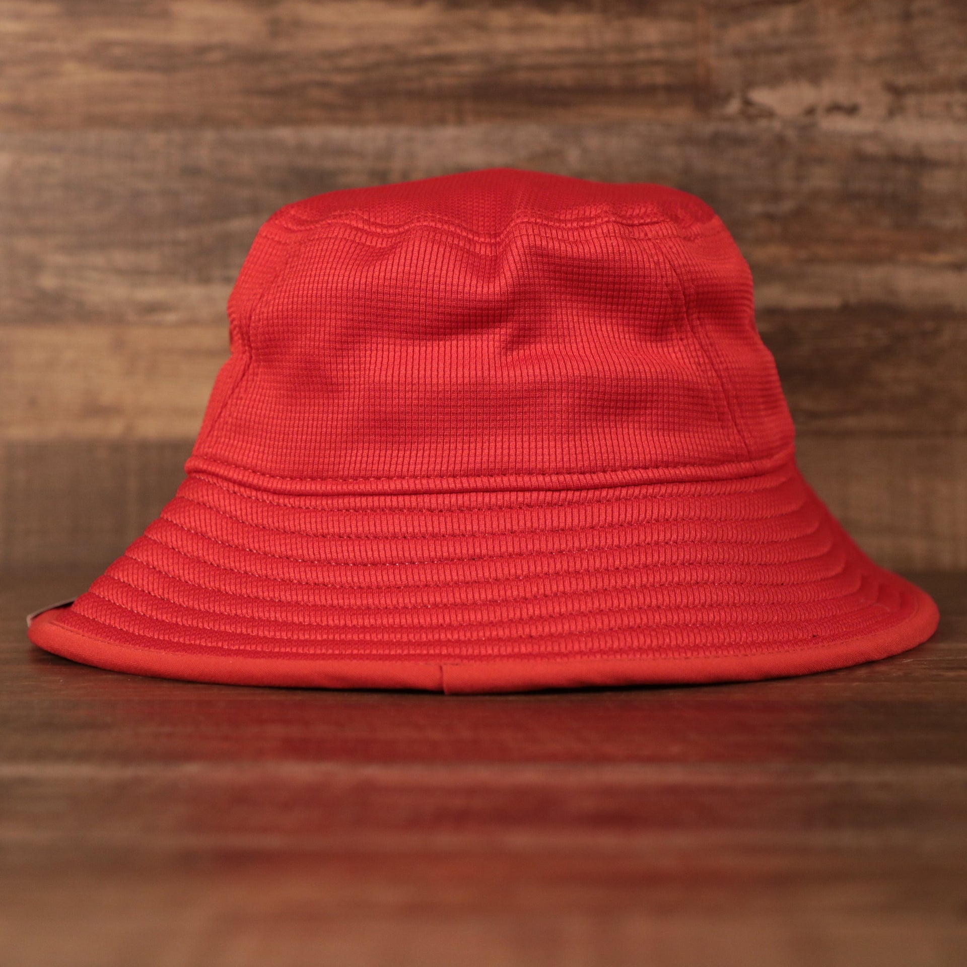The brim of the red Houston Rockets bucket hat.