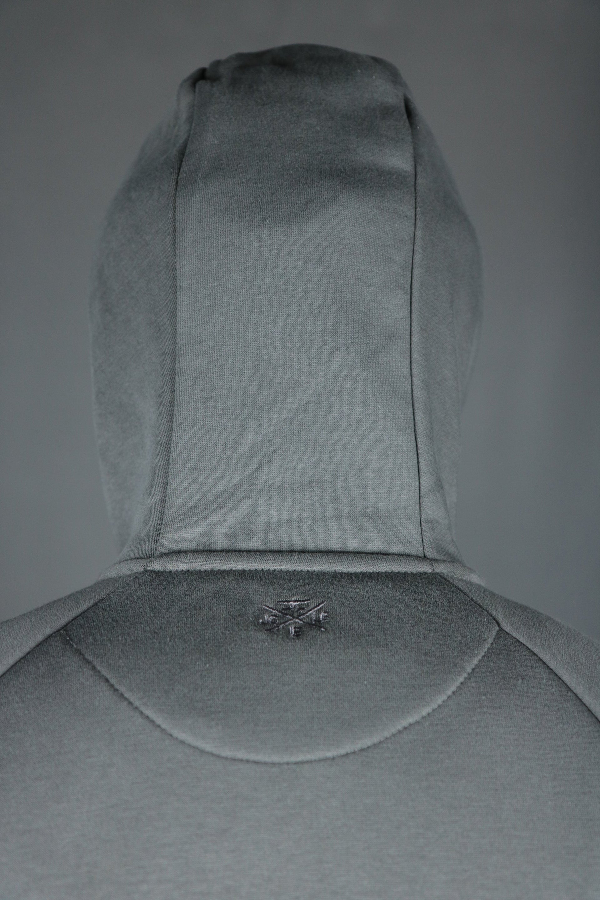 The back side of the Jordan Craig basic tech fleece hoodie.