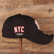 The NYC USA patch on the wearer's right side of the navy MLB fourth of July 2021 New York Yankees 3930 flexfit hat.