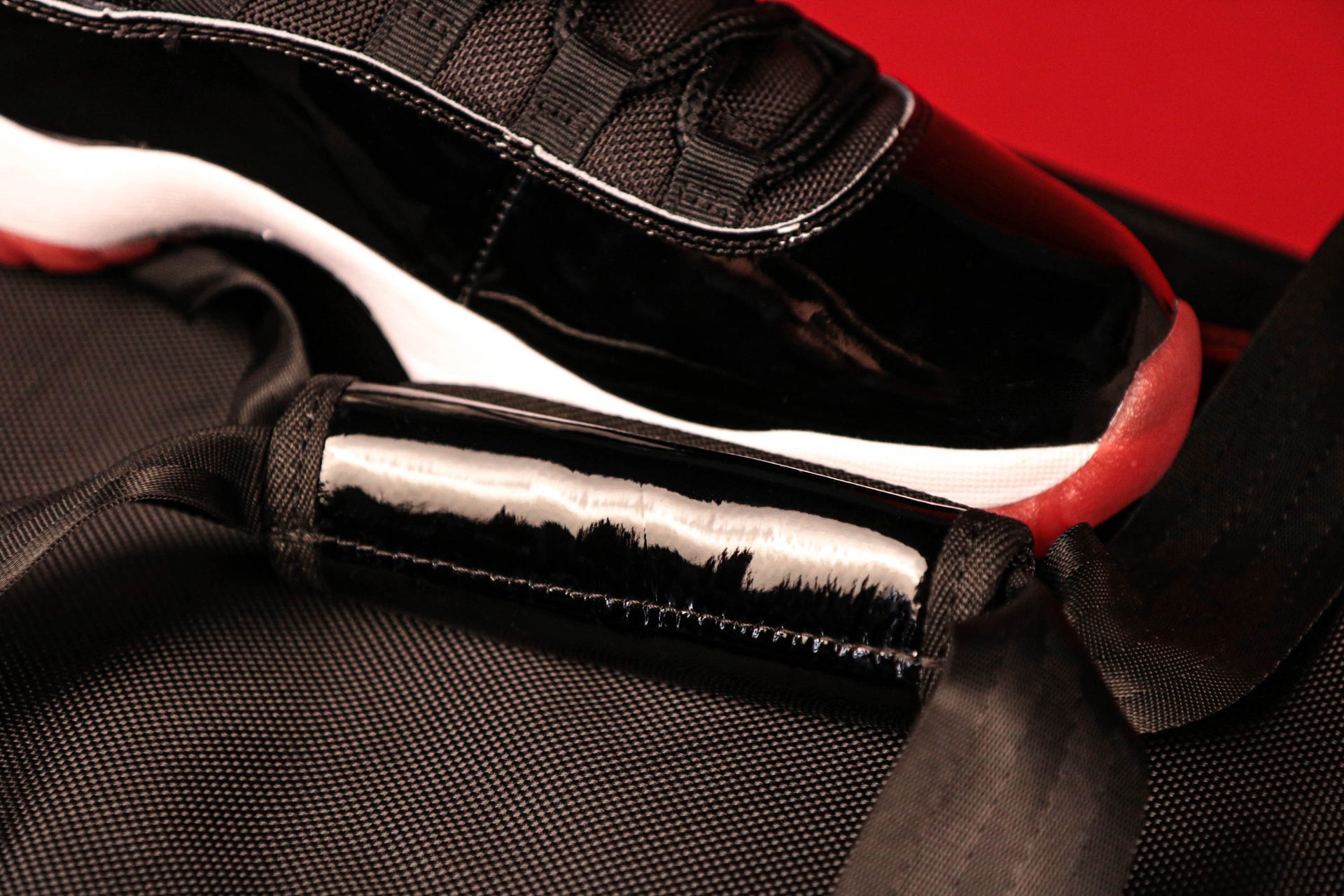 The Handle on the Flight Pack Sneaker Duffle Bag To Match Bred 11s | Sneaker Duffel Travel Bag