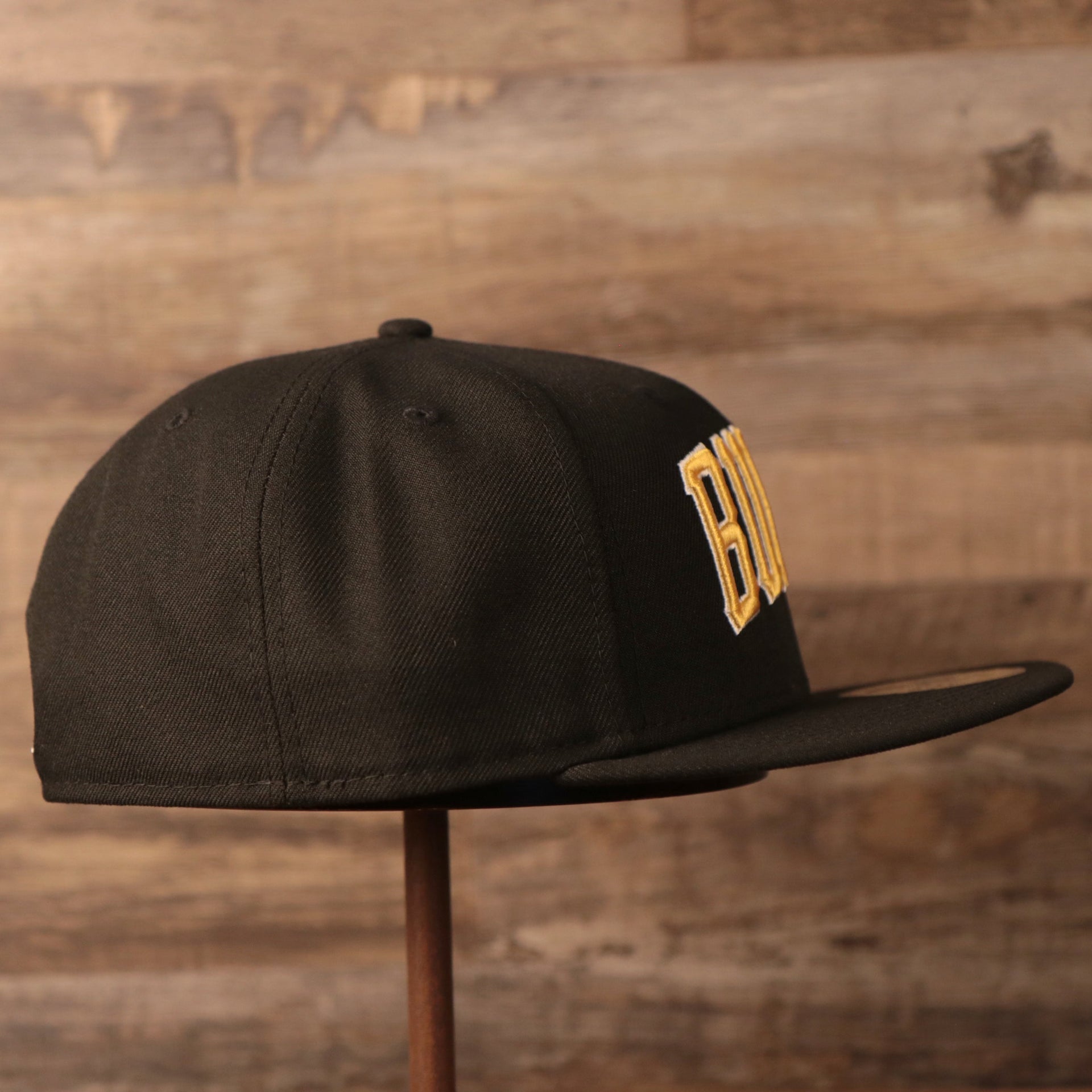 The wearer's right side of The Burgh's black all over embroidered New Era 59fifty.