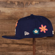 Wearer's left of the Los Angeles Dodgers All Over Floral Pattern Flower Crotchet Side Patch Pink Bottom 59Fifty Fitted Cap