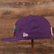 The wearer's left side of the purple Los Angeles Lakers gray brim 5950 all over patch fitted cap has the logo of New Era in white.