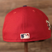 The back of this cap has the mlb logo Phillies Jackie Robinson Fitted Cap | Philadelphia Phillies On-Field Jackie Robinson Side PatchRed Fitted Hat