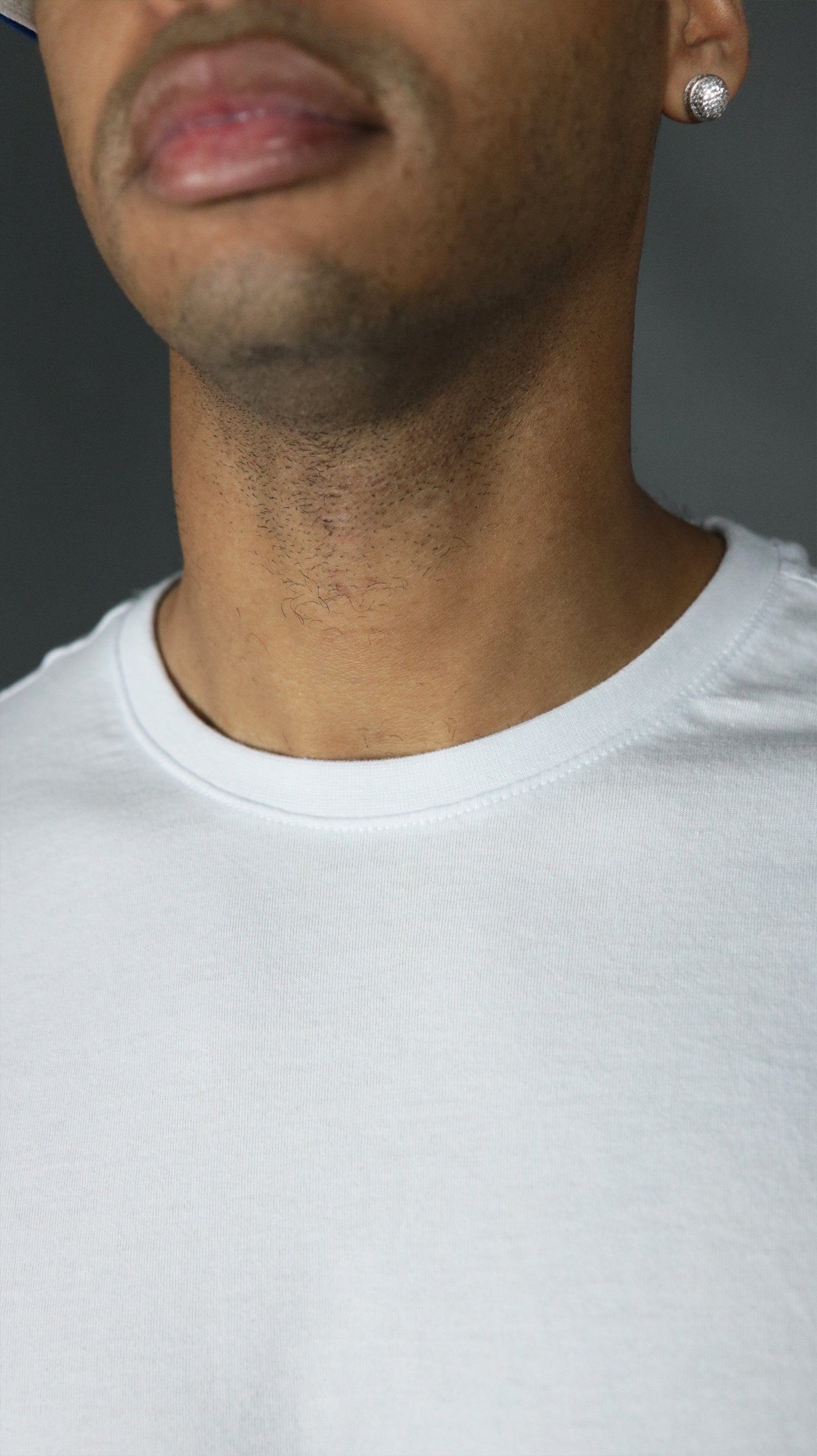The front collar of the Jordan Craig men's scoop bottom tshirt.