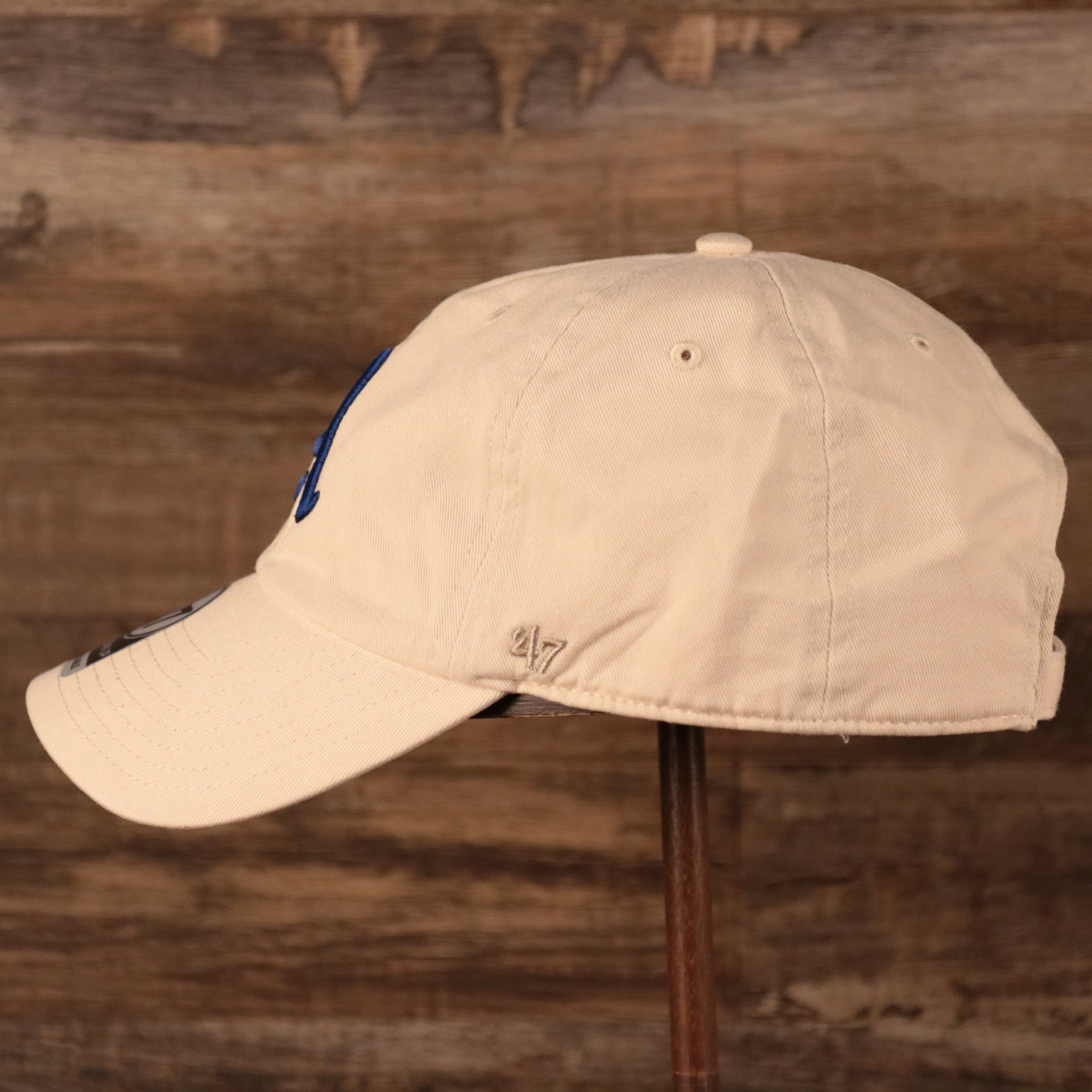 Philadelphia Athletics Royal Blue Logo Retro Cream Dad Hat Wearer's left side of the cap with '47 Clean Up side patch embroidered in tonal cream color