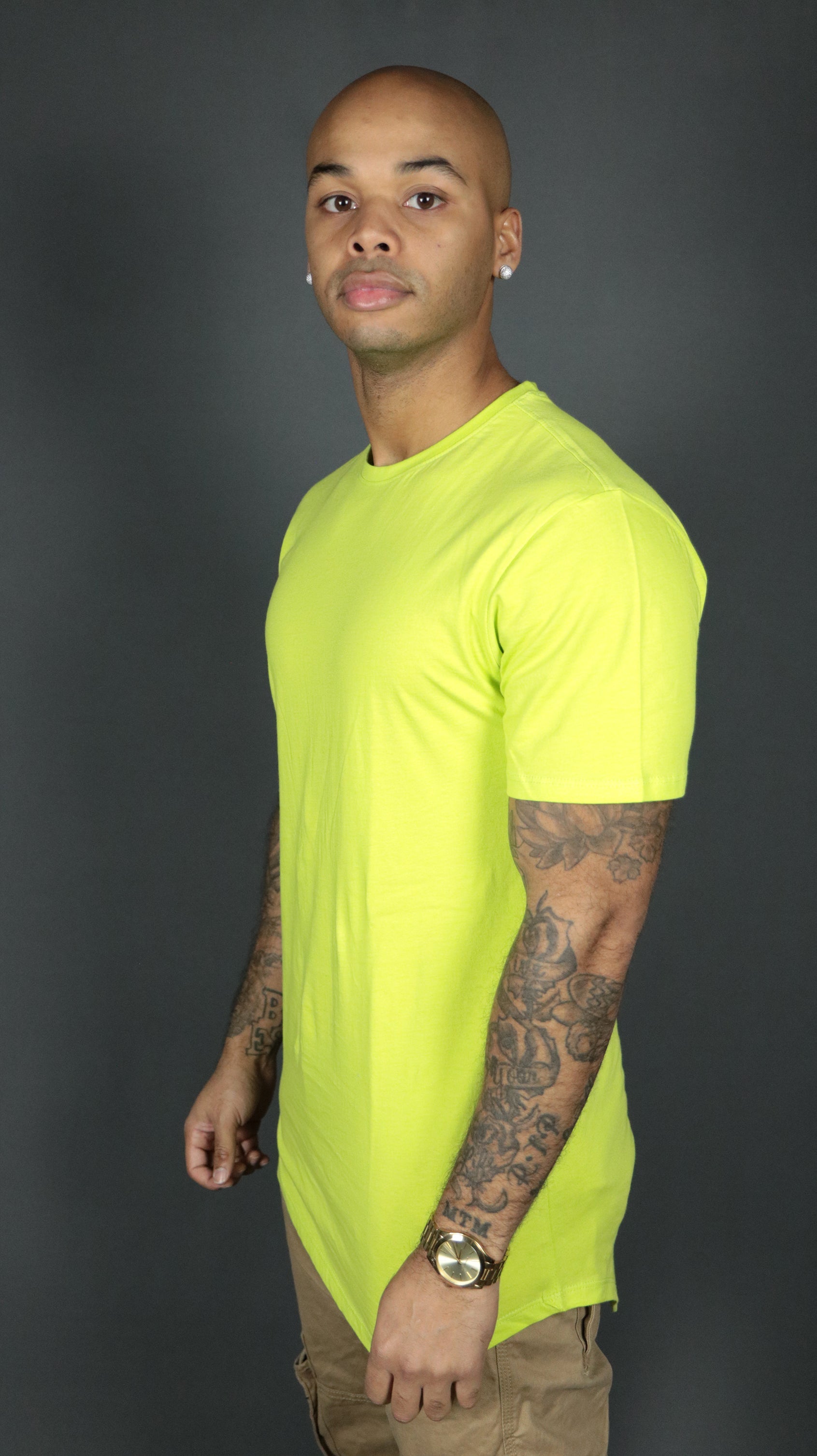 The yellow Jordan Craig longline tshirt for men wore by a model.