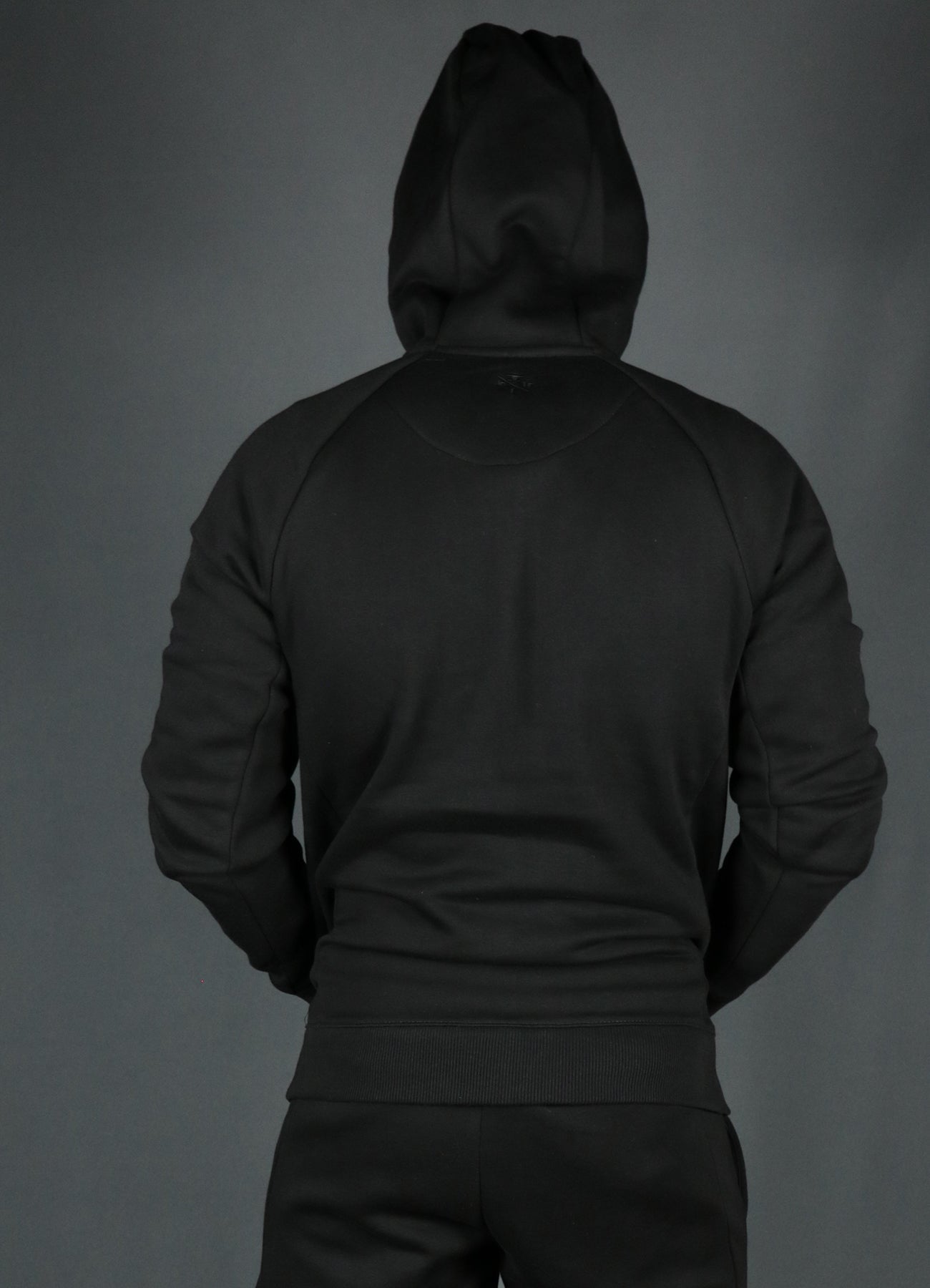 The black Jordan Craig basic fleece zipup hoodie from the back.