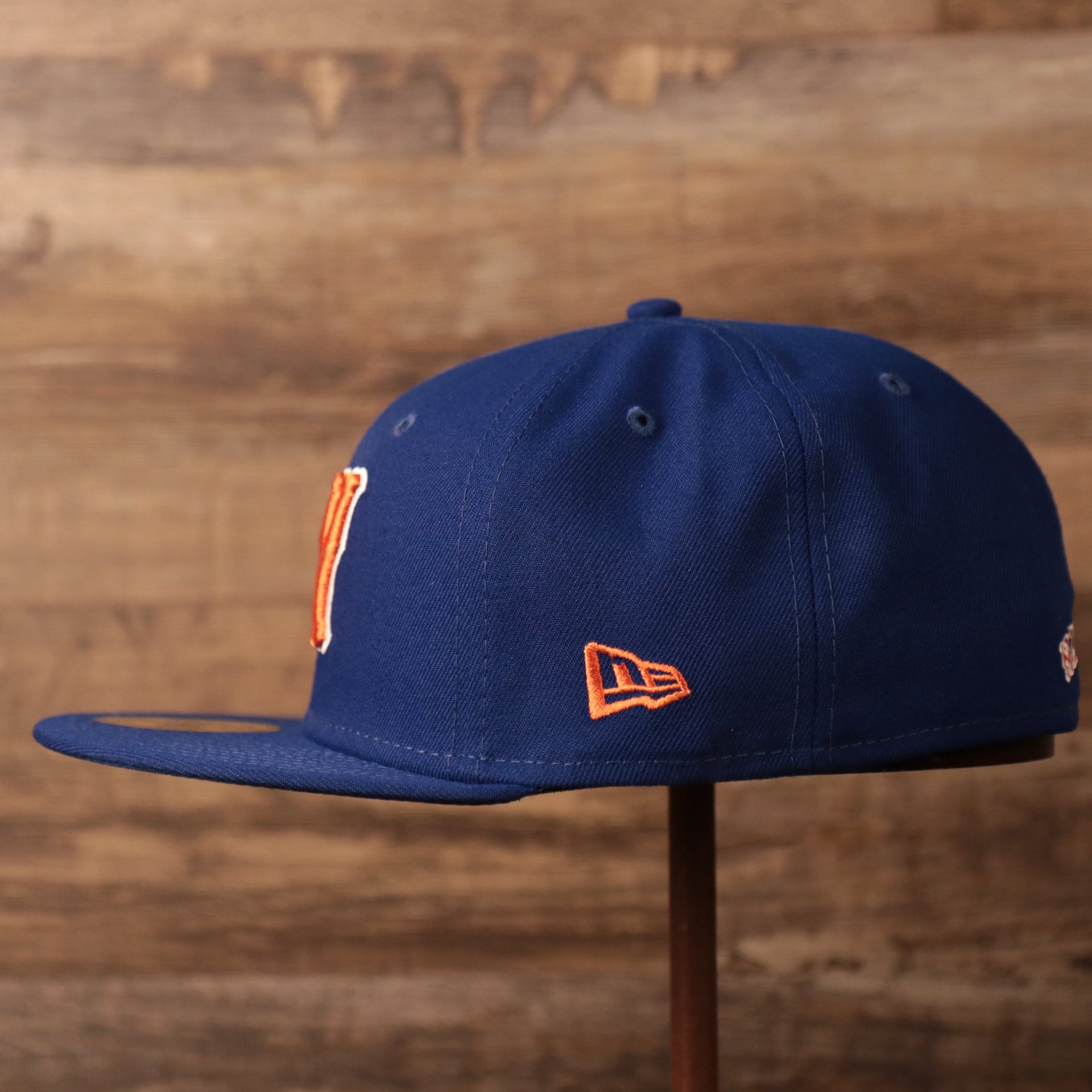 The New Era logo on the left side of the New York Mets blue fitted hat.