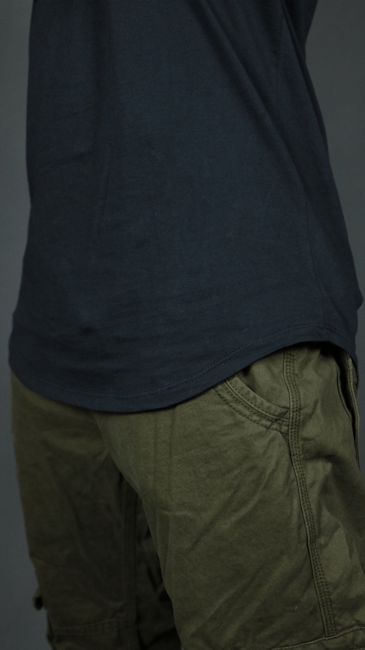 The scoop bottom of the Jordan Craig navy longline tshirt for men.